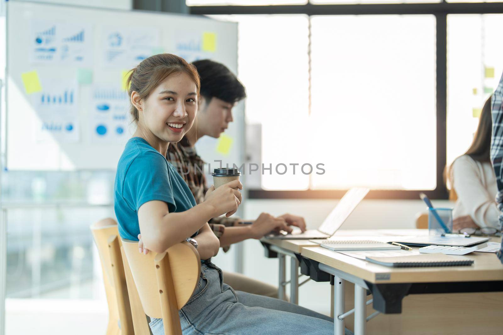 Group of asian young creative happy enjoy laugh smile and great success emotion teamwork people business startup entrepreneur casual brainstorm business meeting office background