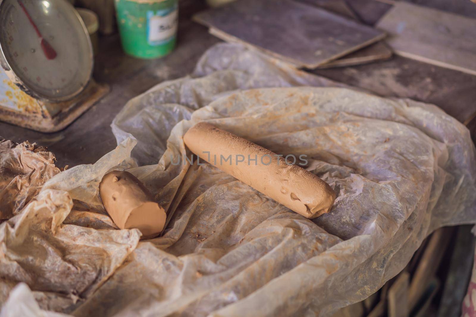 Close up of brown pottery clay for modeling by galitskaya