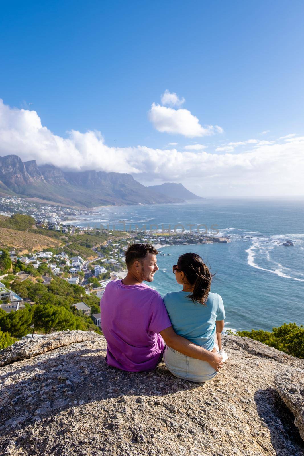 view from The Rock viewpoint in Cape Town over Campsbay, view over Camps Bay with fog over the ocean in Cape Town South Africa by fokkebok