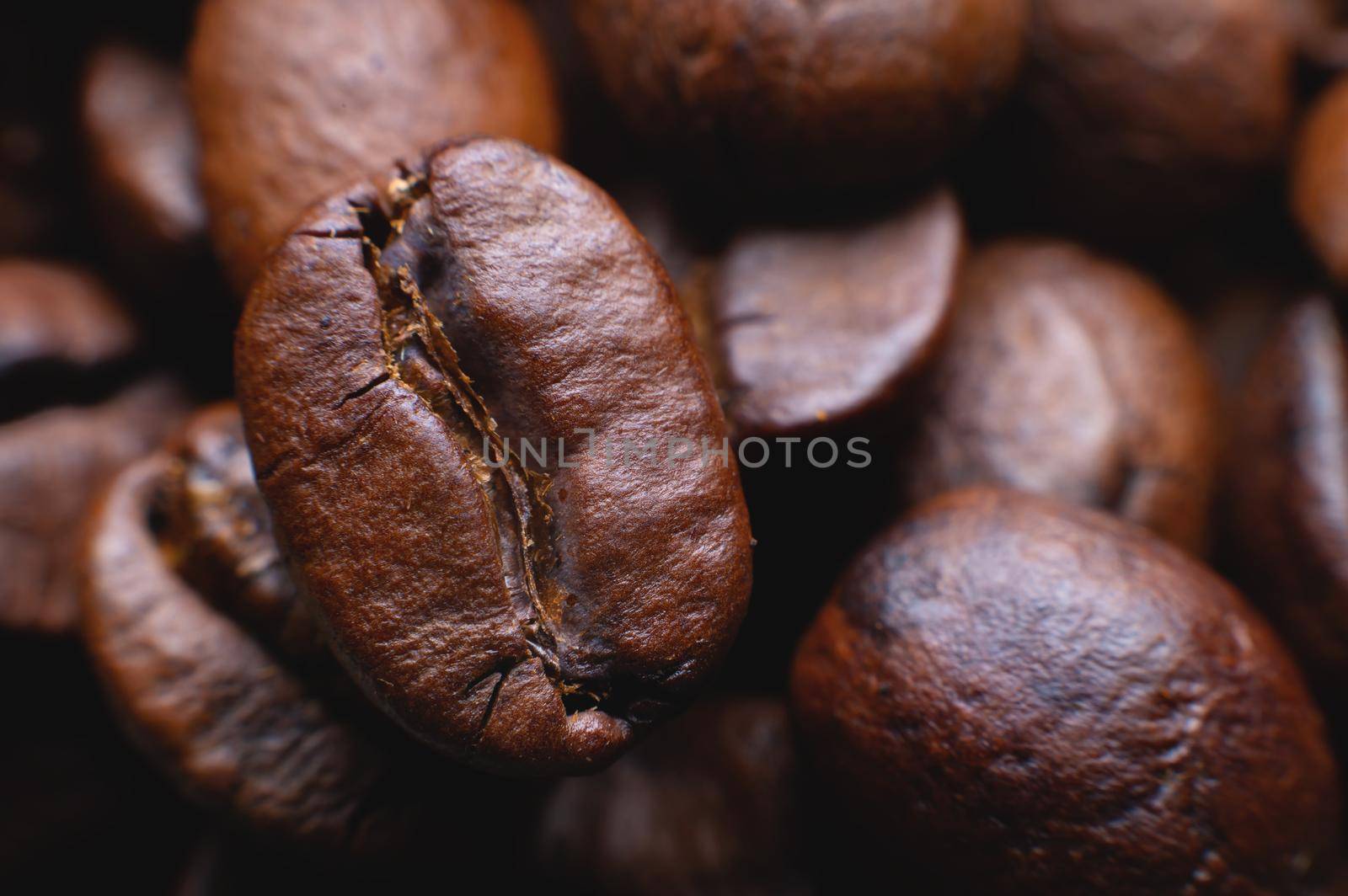 Coffee beans close up for background in shallow depth of field. macro photography by yanik88