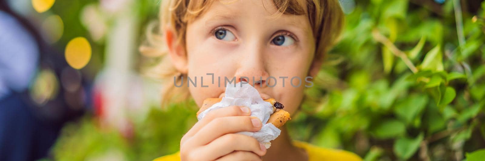 Sweet little caucasian boy, eating pancakes and drinking orange juice BANNER, LONG FORMAT by galitskaya