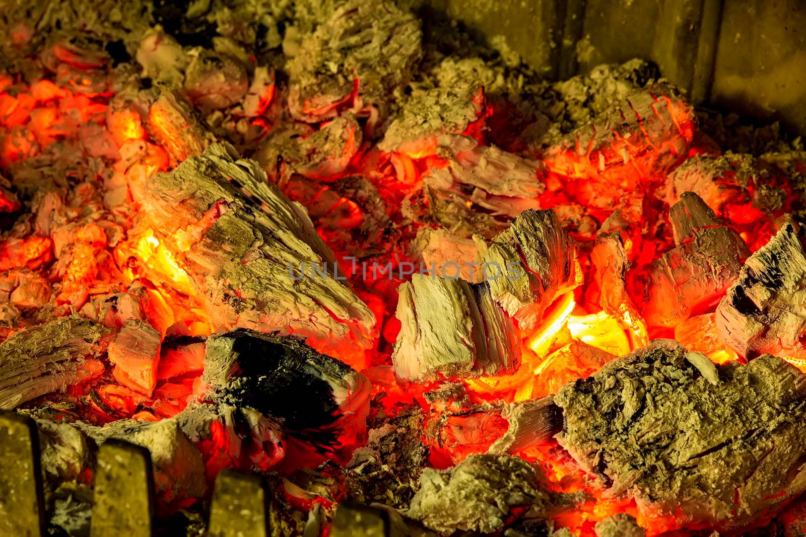 charcoals of a bonfire in a fireplace. feelings of comfort 