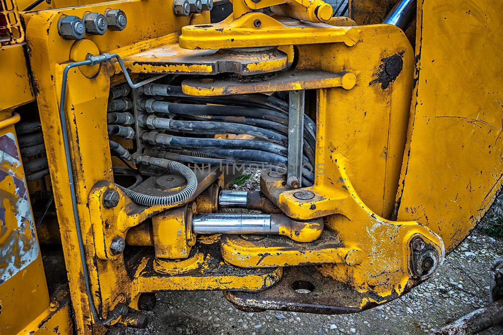 Detail of modern yellow excavator machines. Close up