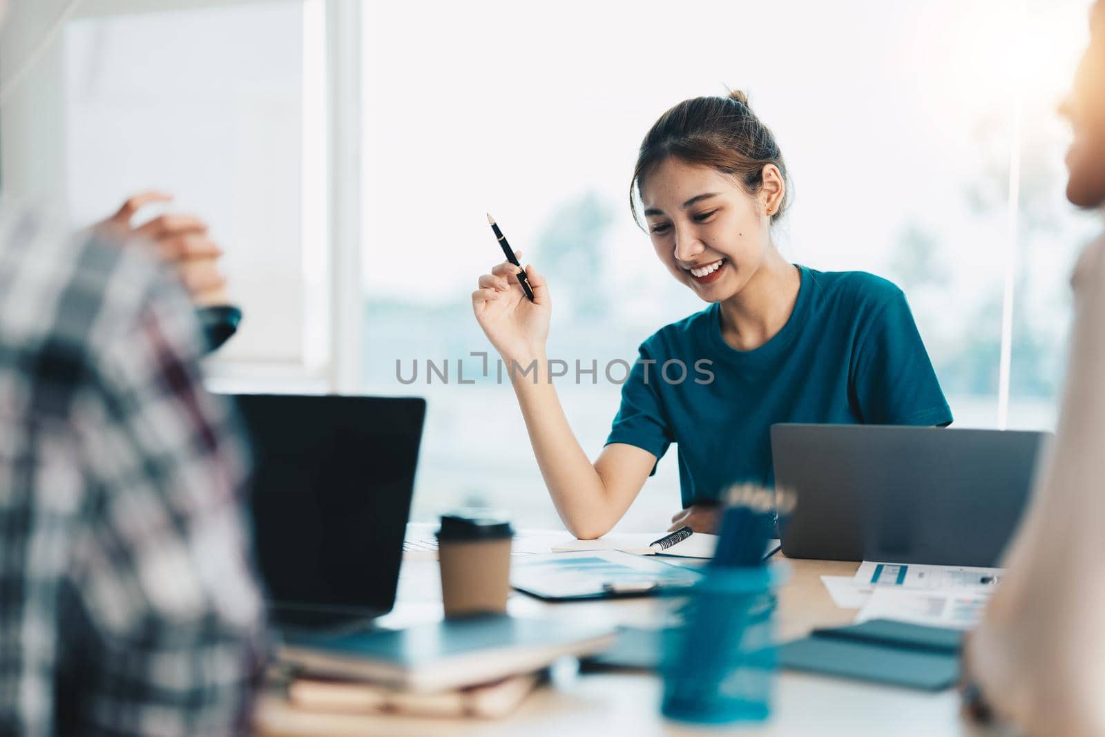 Group of asian young creative happy people entrepreneur on a business meeting office background Good leadership and teamwork lead to success by nateemee