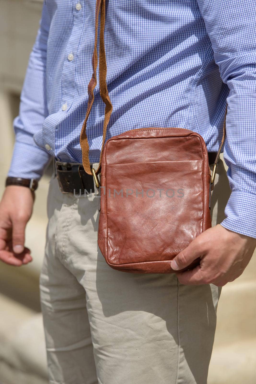 close-up photo of orange leather bag . street photo