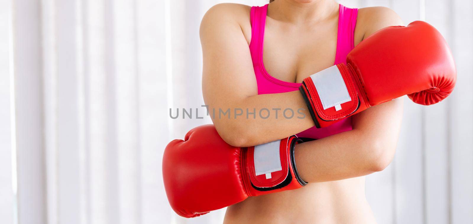 Boxer woman does boxing sport in fitness gym. by biancoblue