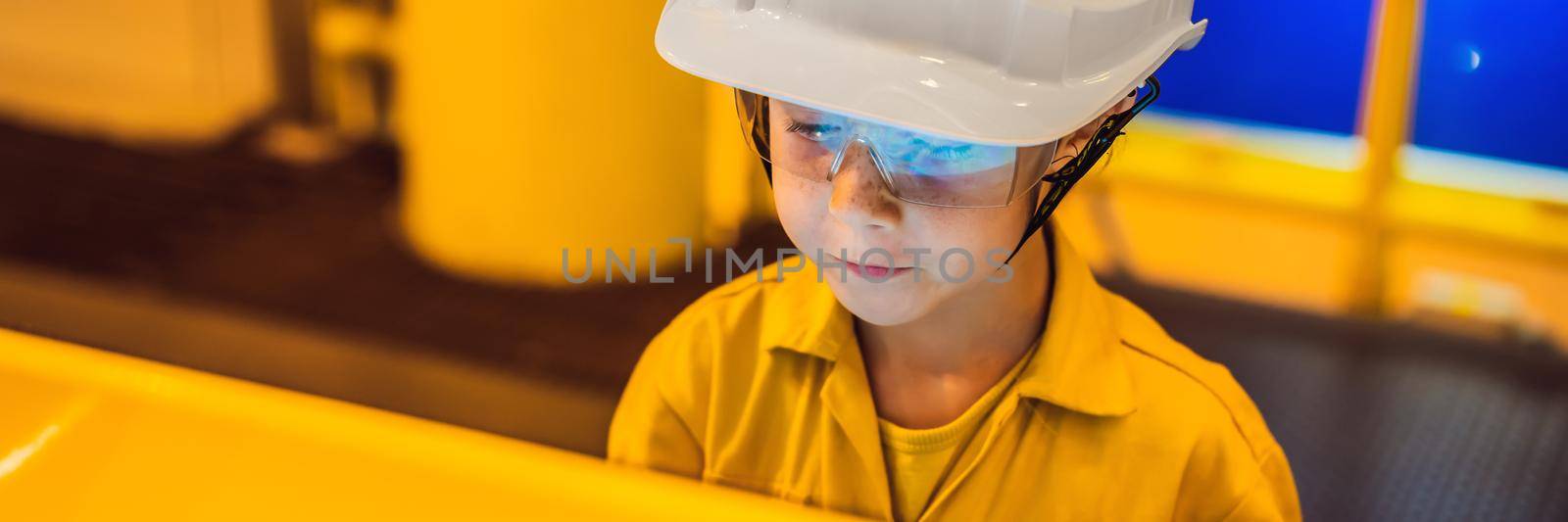 Boy operator recording operation of oil and gas process at oil and rig plant, offshore oil and gas industry, offshore oil and rig in the sea, operator monitor production process, routine daily record. Real life education BANNER, LONG FORMAT by galitskaya