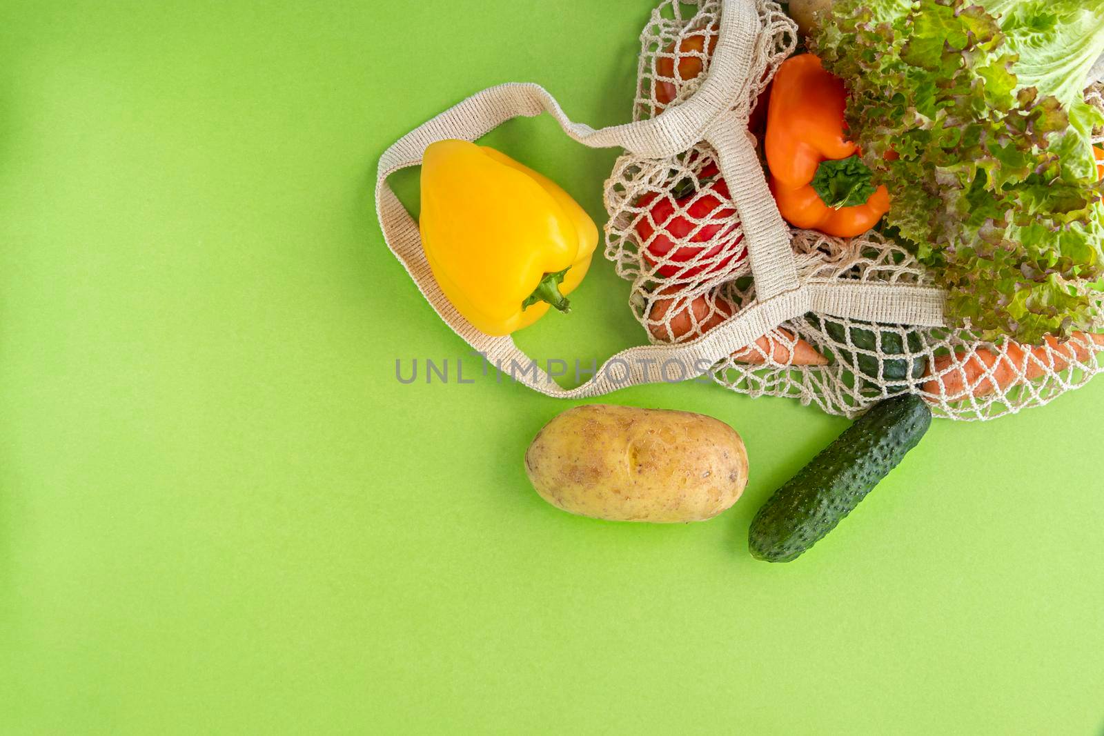 Package-free food shopping. top view of eco friendly natural bag with vegetables. Zero waste concept. Sustainable lifestyle concept. Plastic free items. Flat lay. by Leoschka