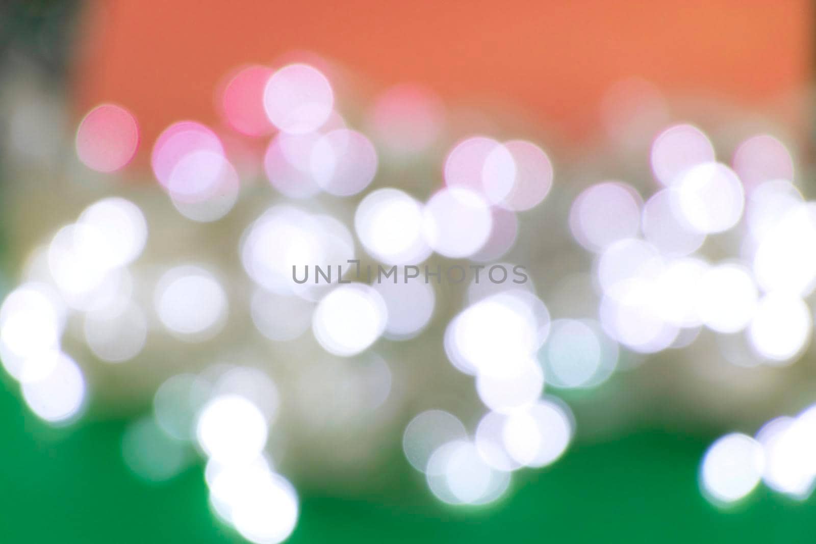 blurred red green background with white bokeh. by Leoschka