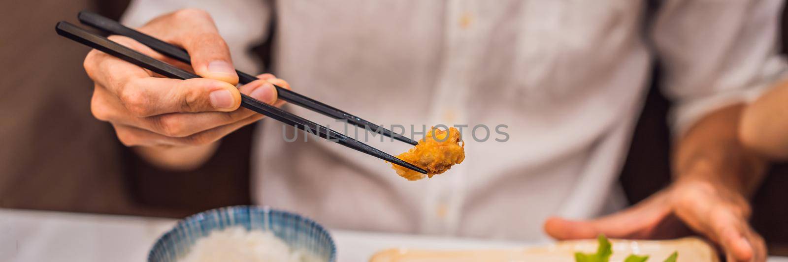 Bento set of prawn tempura and chicken teriyaki in japanese restaurant BANNER, LONG FORMAT by galitskaya