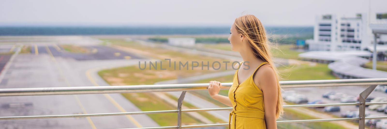 Start of her journey. Beautiful young woman ltraveler in a yellow dress and a yellow suitcase is waiting for her flight. BANNER, LONG FORMAT