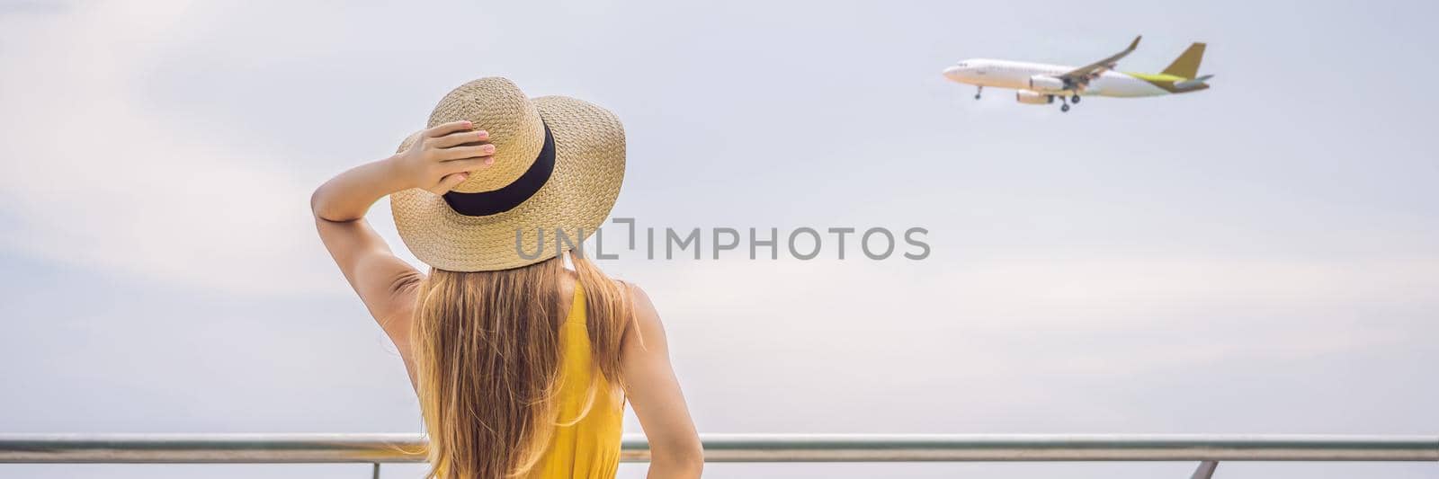 Start of her journey. Beautiful young woman ltraveler in a yellow dress and a yellow suitcase is waiting for her flight BANNER, LONG FORMAT by galitskaya