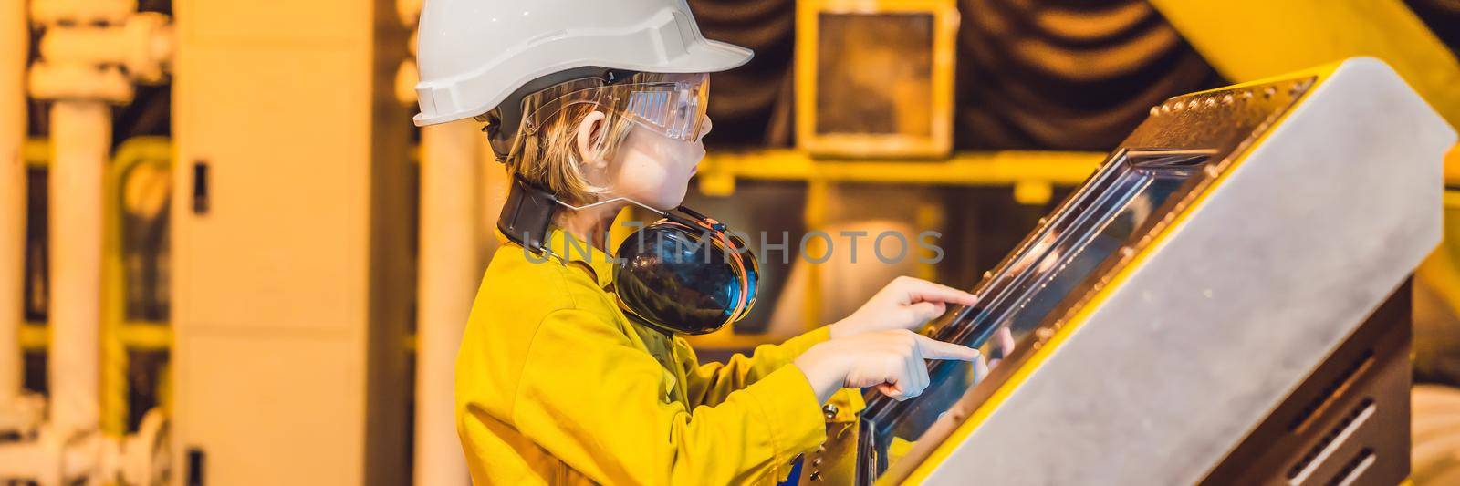 BANNER, LONG FORMAT Boy operator recording operation of oil and gas process at oil and rig plant, offshore oil and gas industry, offshore oil and rig in the sea, operator monitor production process, routine daily record by galitskaya