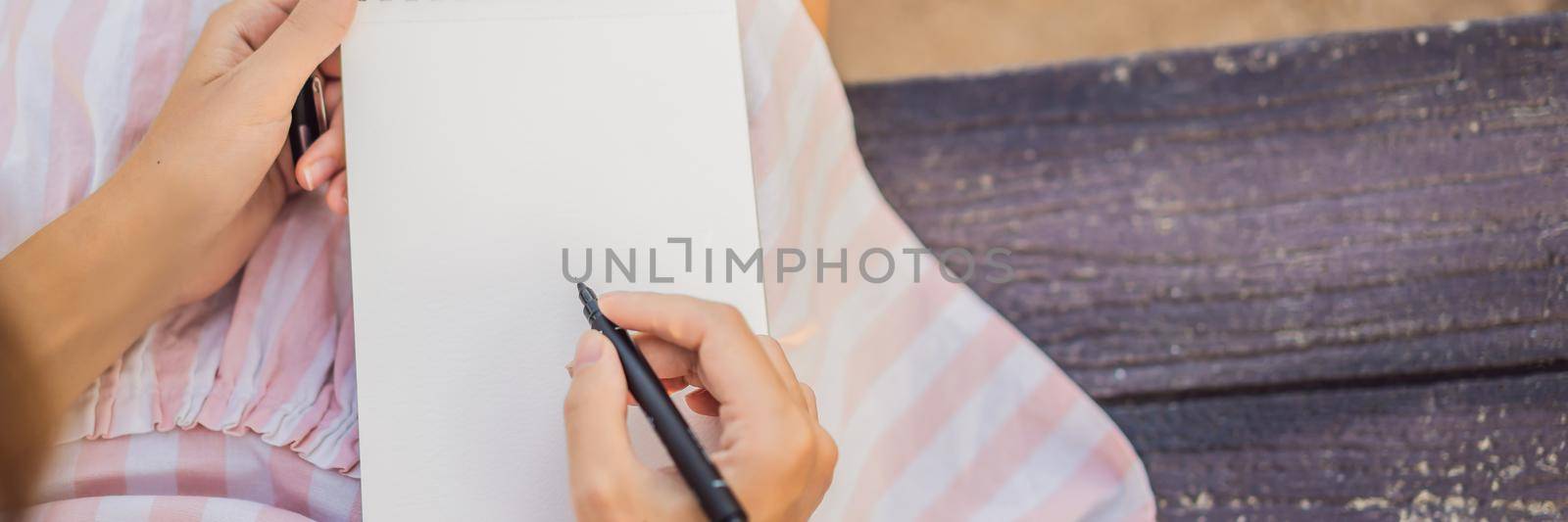 Women's hands in a tropical background holding a signboard paper, mockup BANNER, LONG FORMAT by galitskaya