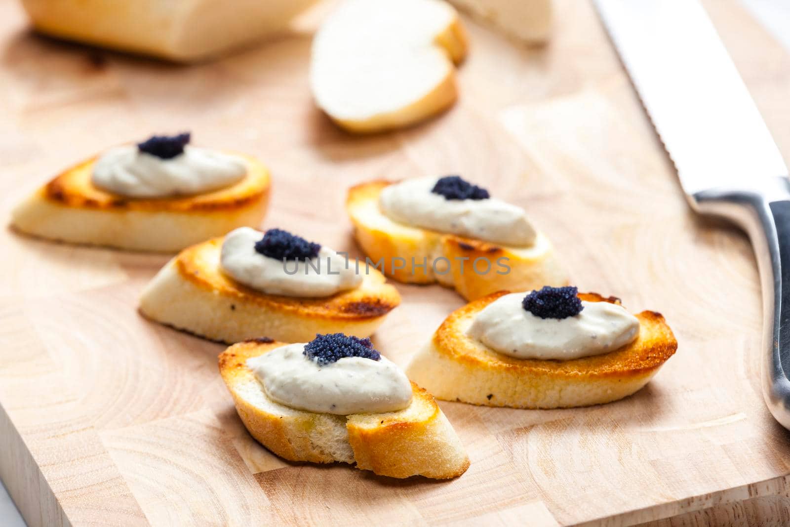 anchovy spread on toasted baguette slices