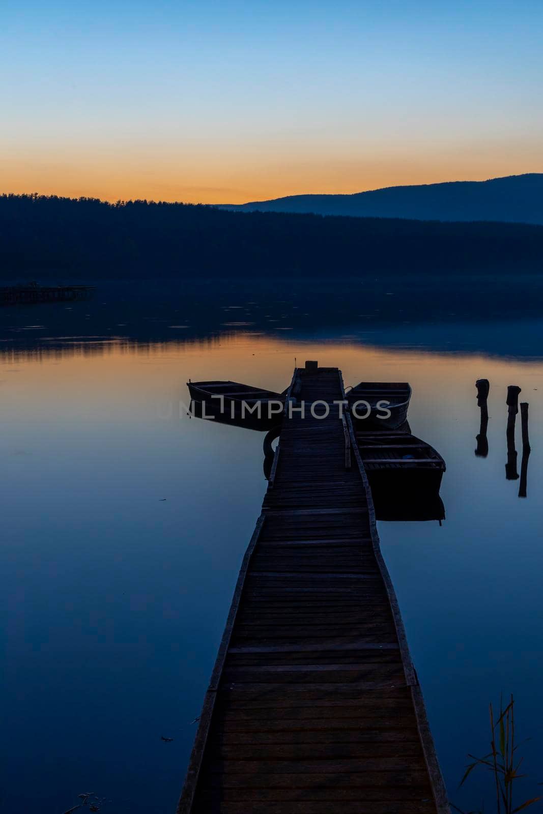 fishing boat at pier on Jenoi pond near Diosjeno, Northern Hungary by phbcz