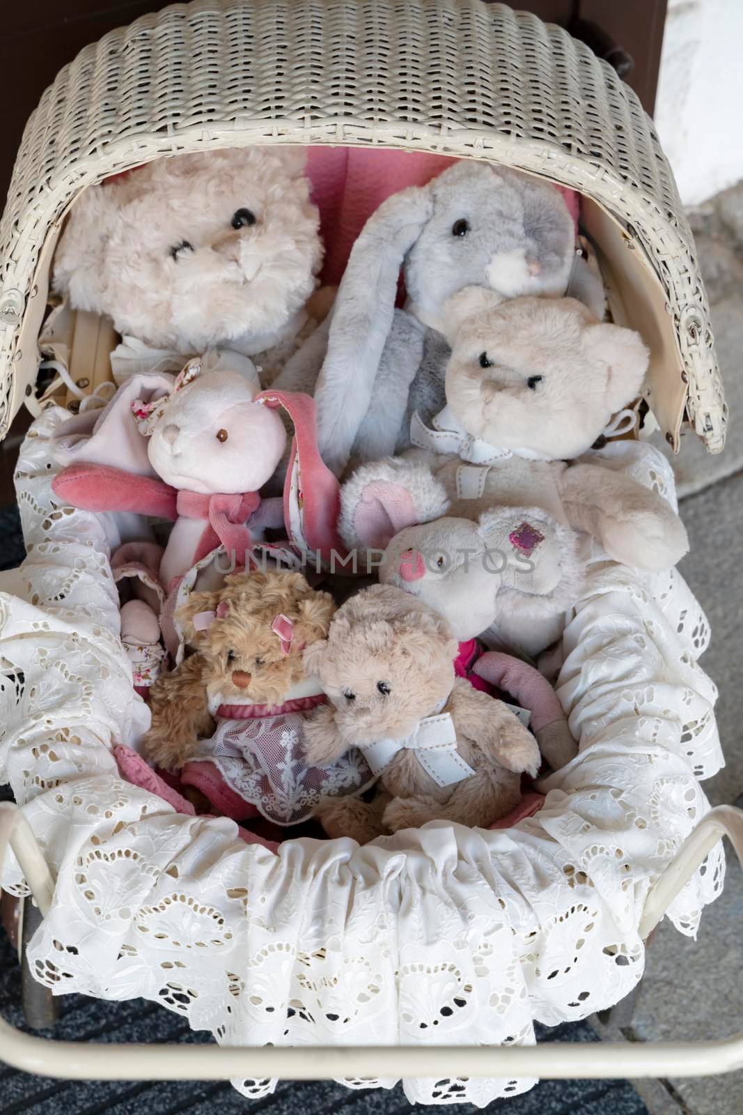 stuffed toys in the old fashioned buggy