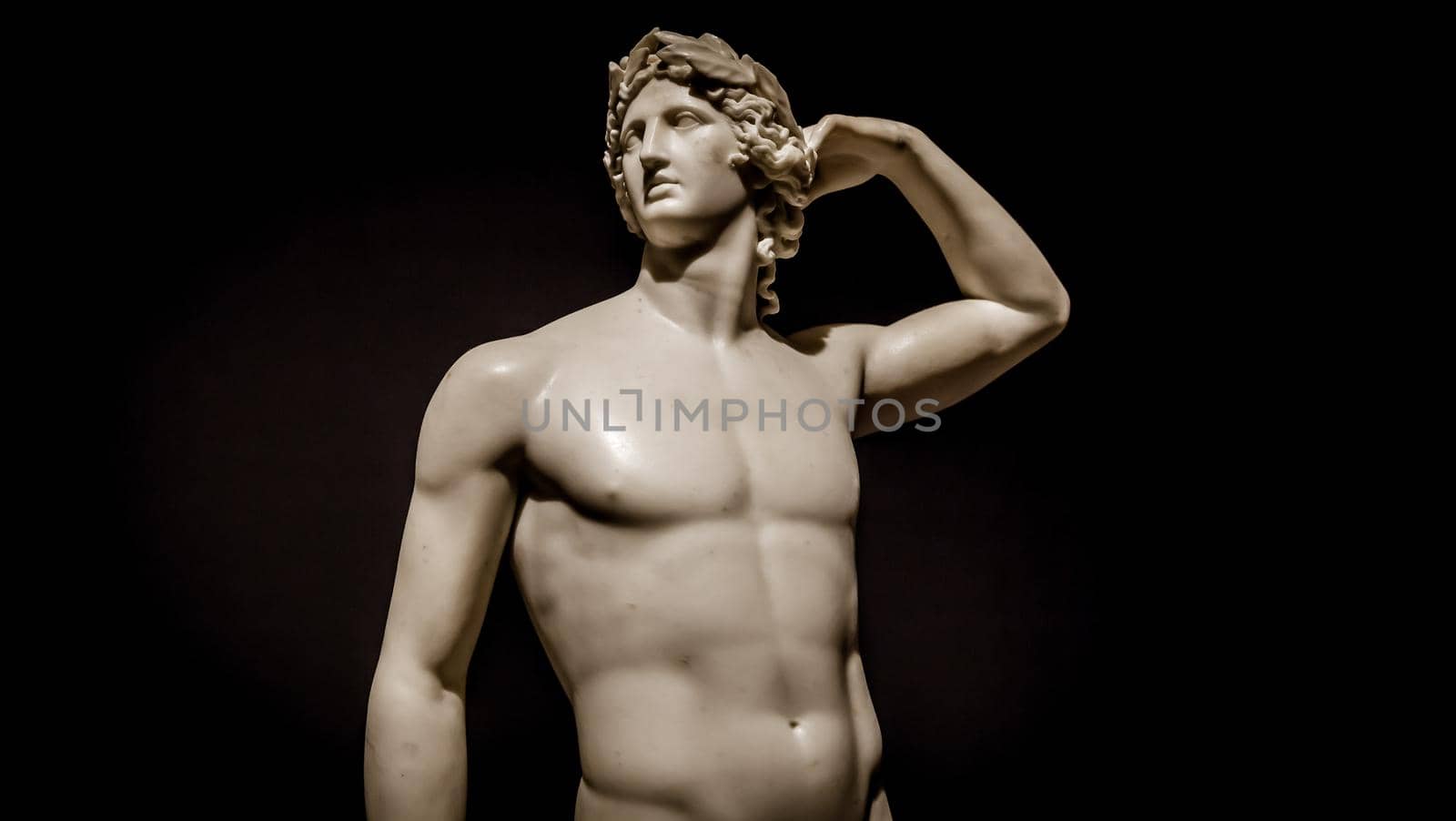 MILAN, ITALY - June 2020:  the ancient sculpture Apollo Crowning Himself - 1782 - Antonio Canova's masterpiece. Intesa Italian Museum.