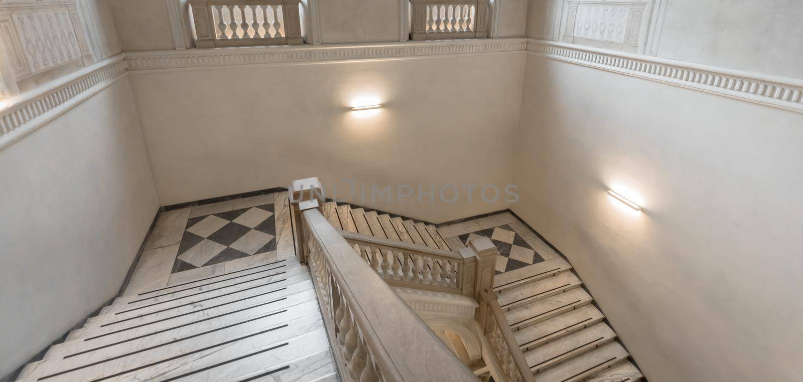 Luxury staircase made of marble in an antique Italian palace by Perseomedusa
