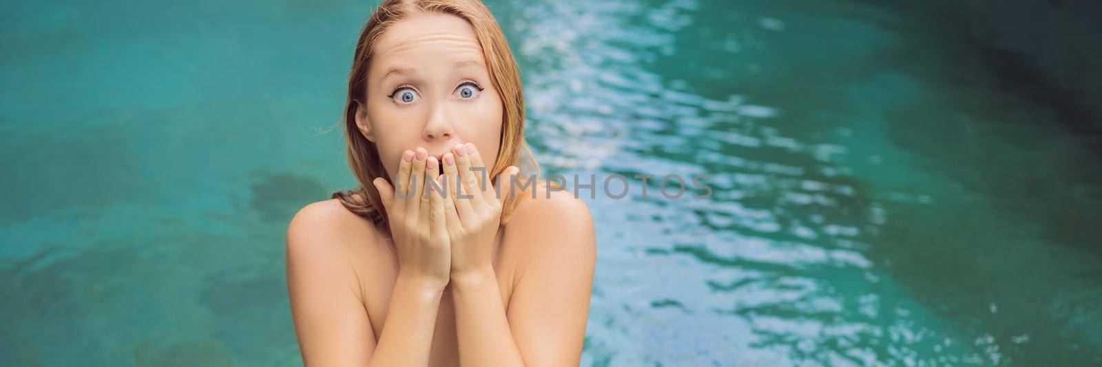 Frustrated young woman having a bad skin in the pool. Due to the fact that chemicals in the pool. BANNER, LONG FORMAT