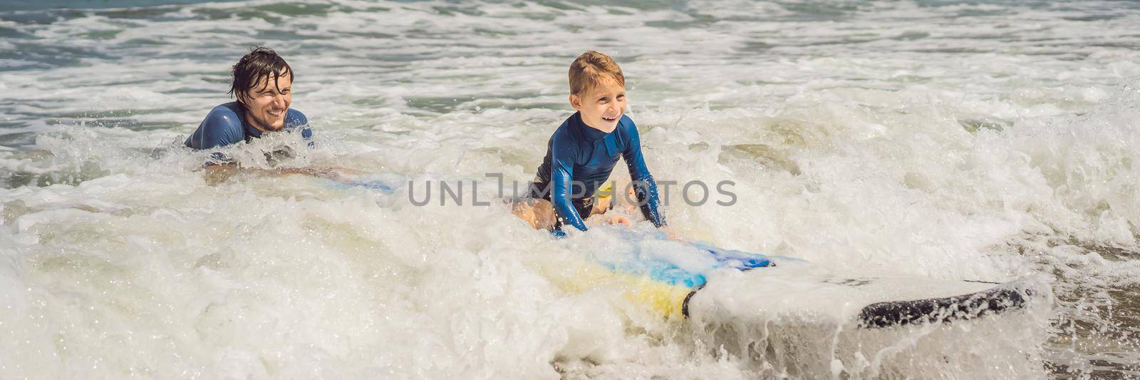BANNER, LONG FORMAT Father or instructor teaching his 5 year old son how to surf in the sea on vacation or holiday. Travel and sports with children concept. Surfing lesson for kids by galitskaya