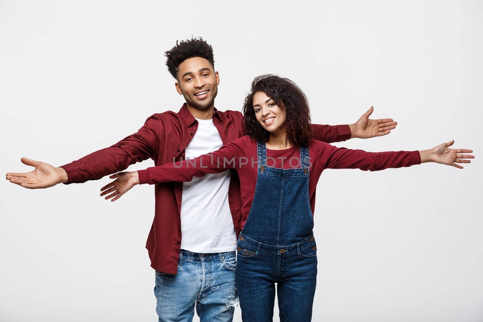 Happy young African couple dressed casually having fun together