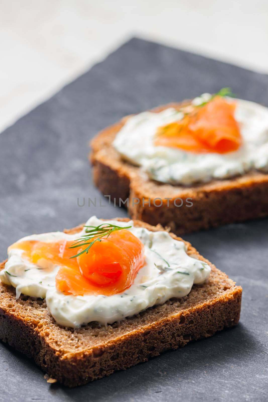 whole grain bread with dill spread and smoked salmon by phbcz