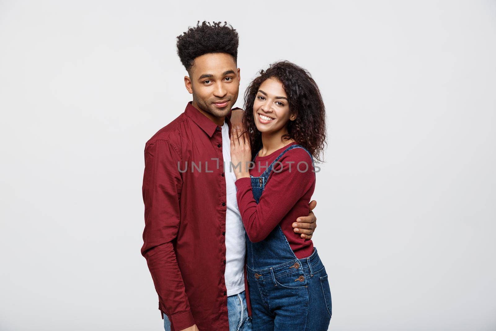 portrait of happy african american couple hug each other on white background. by Benzoix