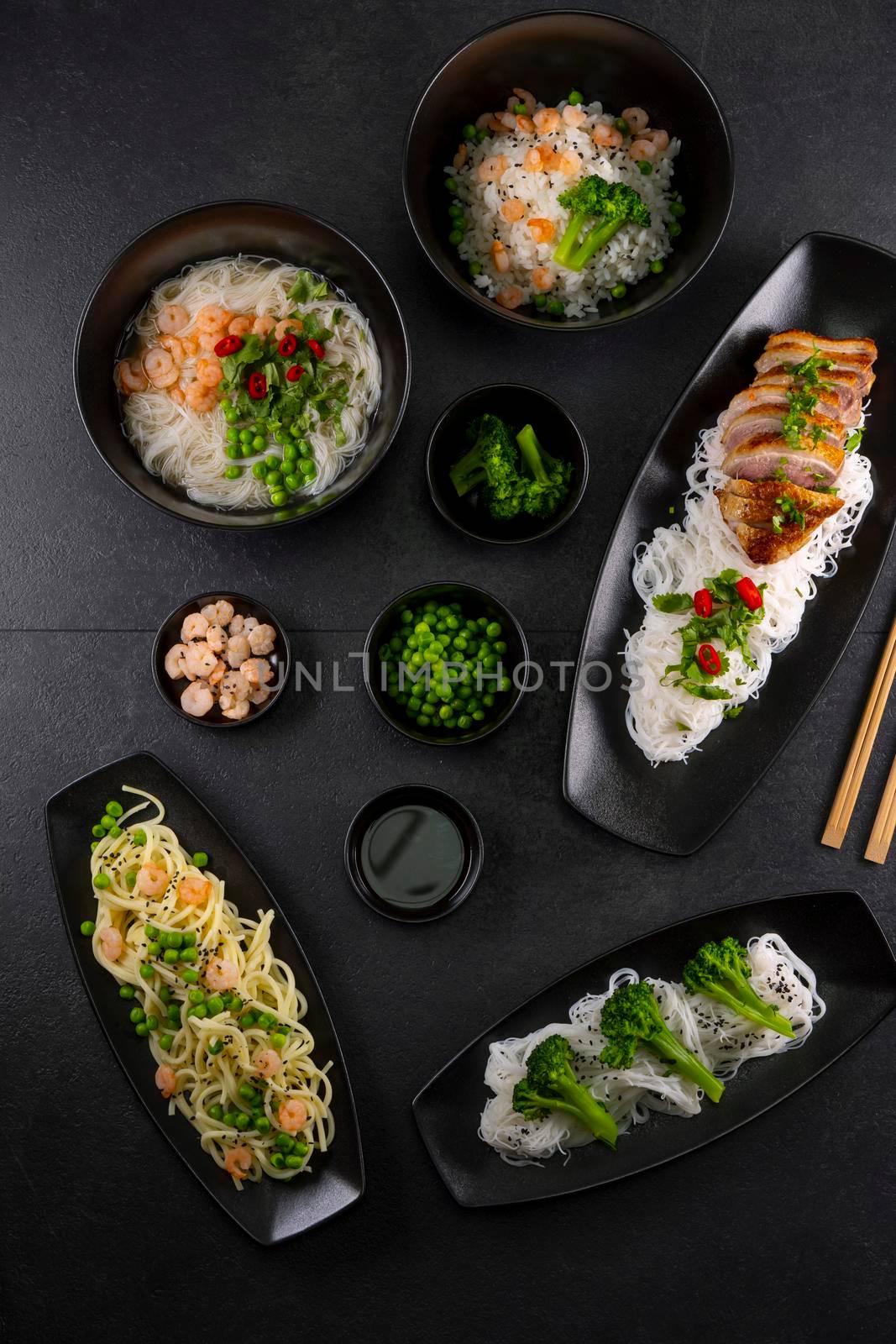 Various dishes of Asian cuisine with different types noodles and rice with shrimp, duck, vegetables and black sesame by phbcz