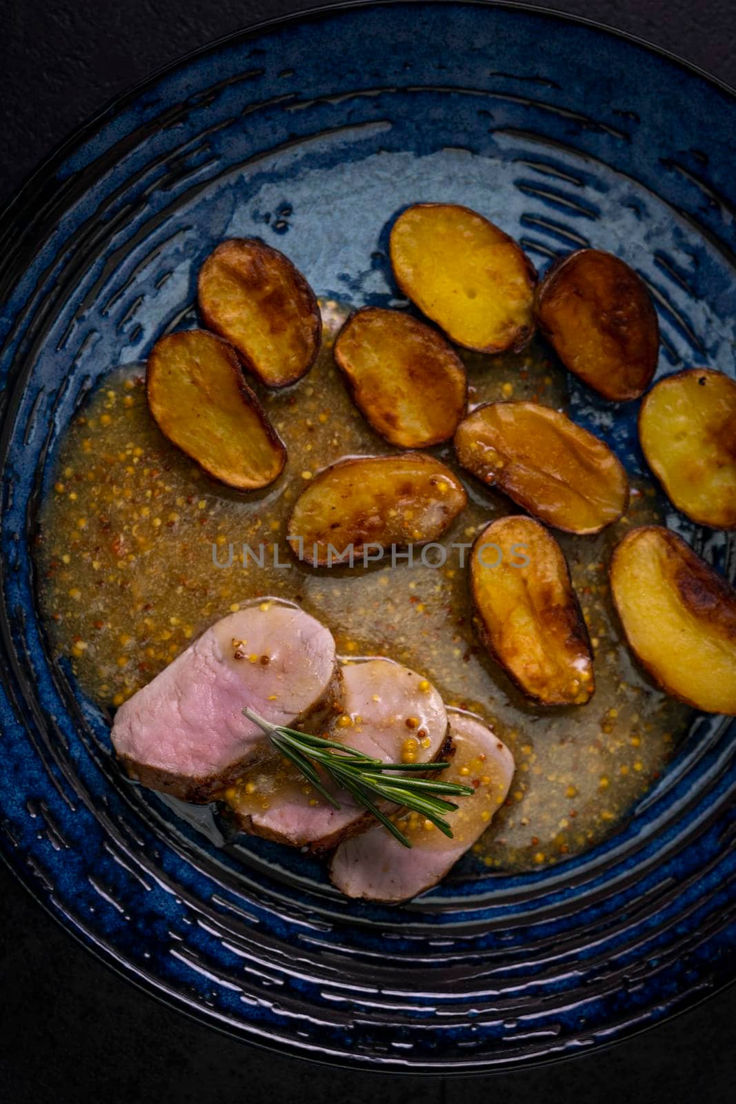 pork tenderloin with baked potatoes and French coarse mustard sauce by phbcz