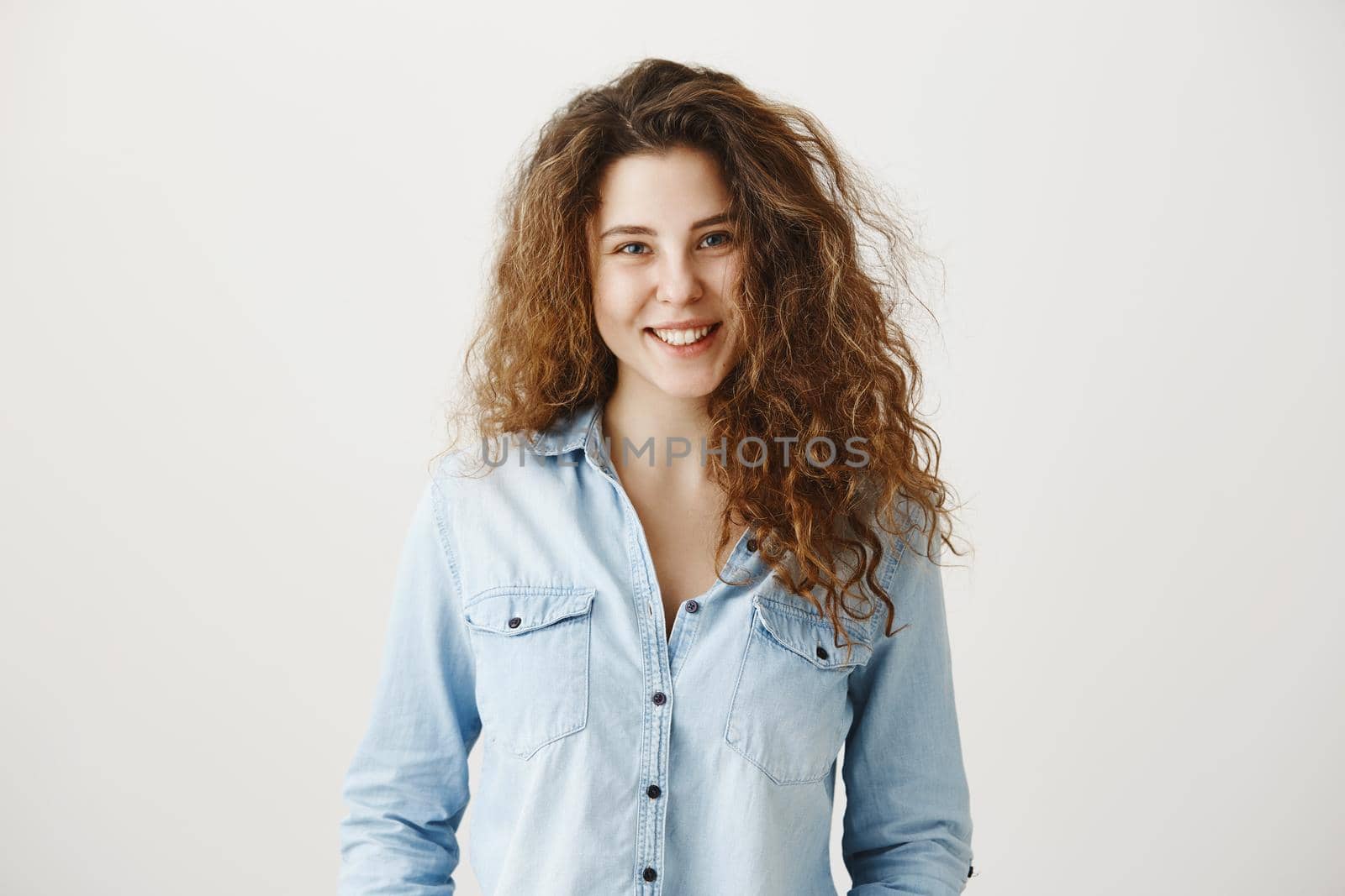 Close-up portrait of beautiful tender brunette woman looking , isolated on grey background.
