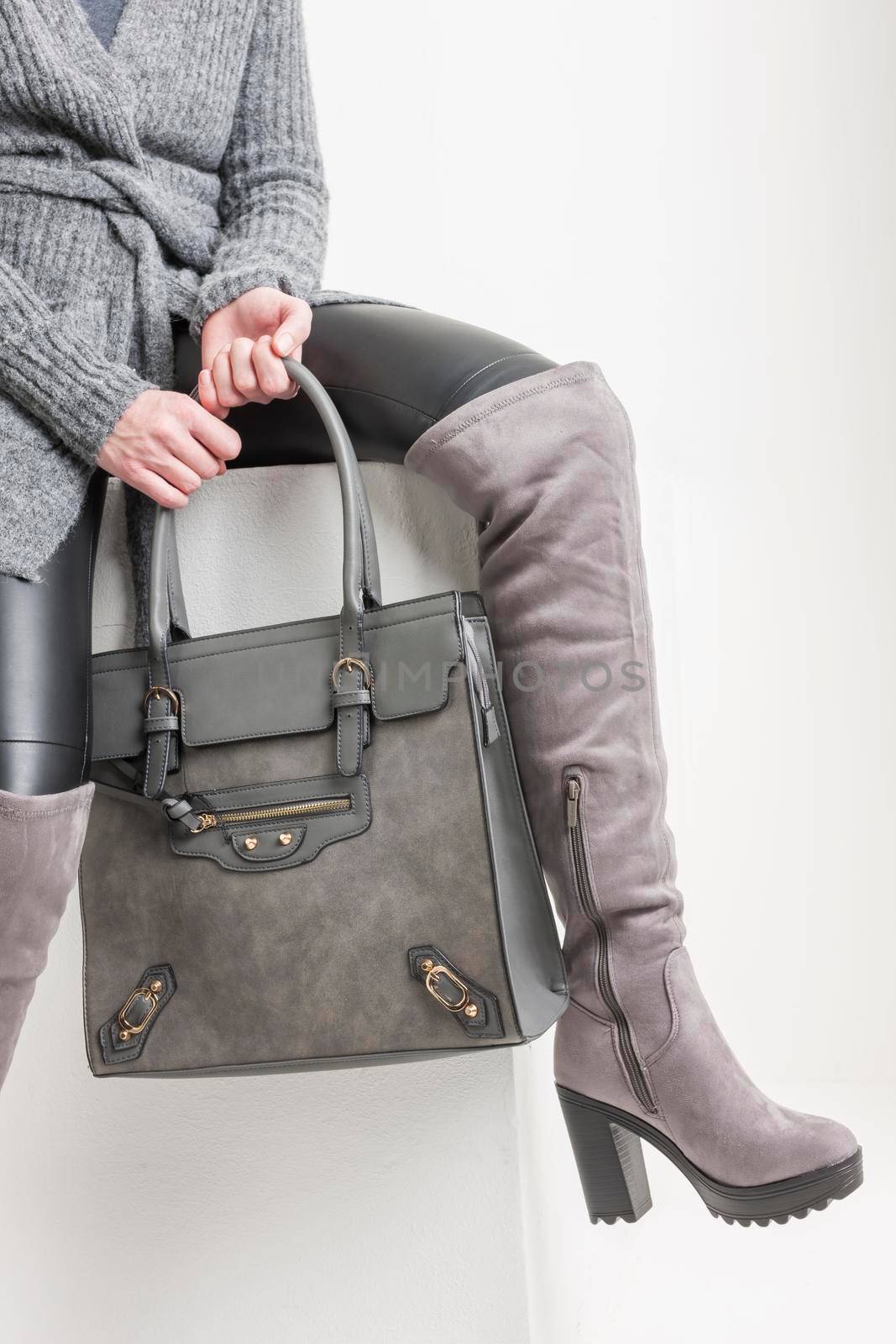 gray women's boots with a handbag by phbcz