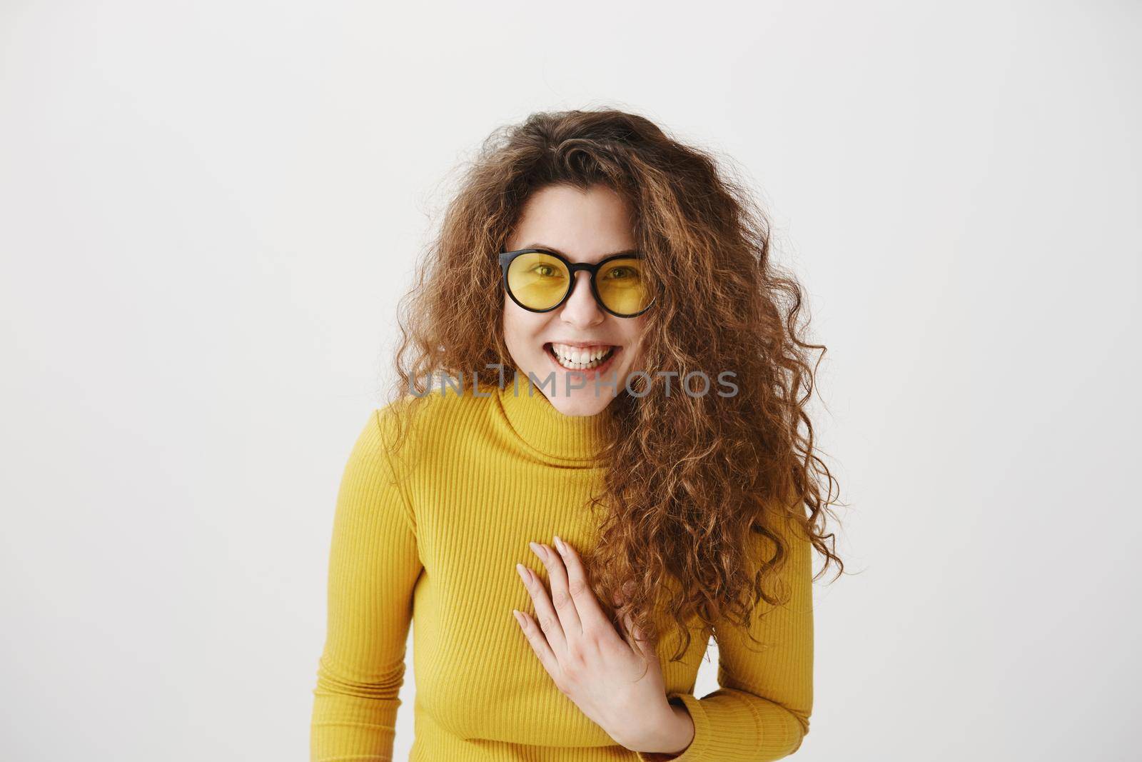 Portrait of beautiful cheerful redhead girl with curly hair smiling laughing looking at camera over white background. by Benzoix