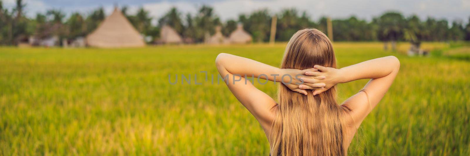 Women tourists enjoy the panoramic view of the beautiful Asian scenery of rice fields. BANNER, LONG FORMAT