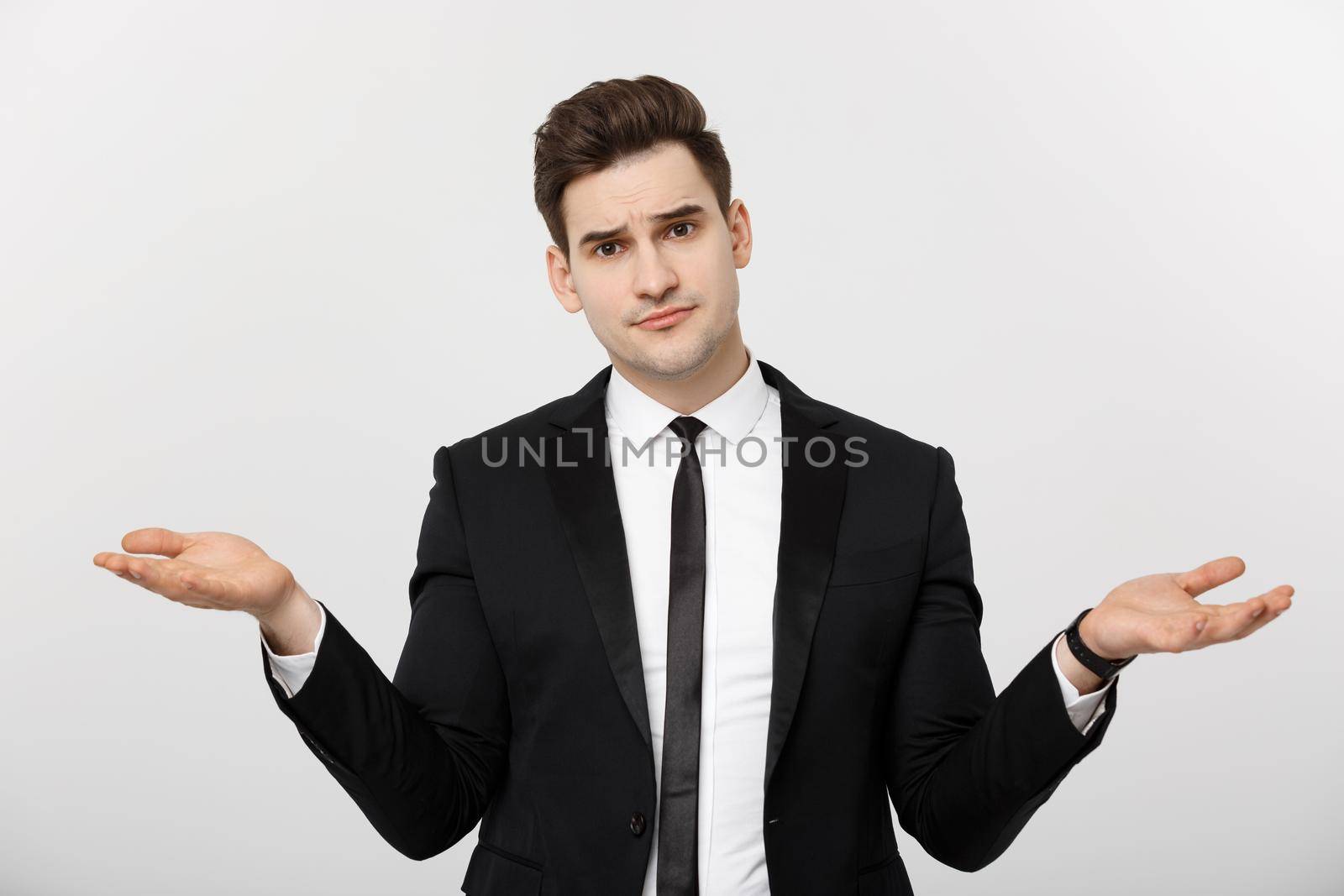 Business Concept: Portrait handsome young businessman point hands on side to empty copy space. Concept of advertisement product, isolated over white background