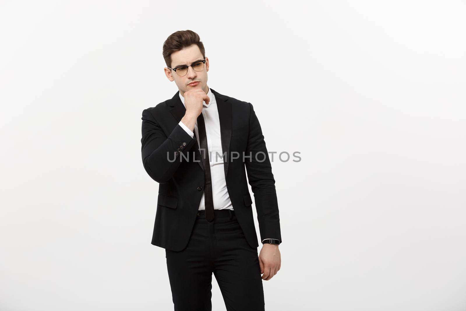 Business Concept: Portrait of Thoughtful handsome Businessman wearing ...