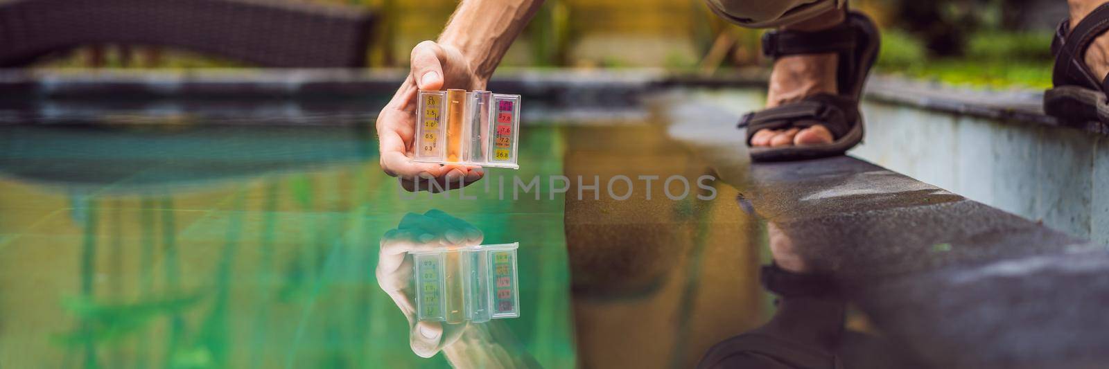 Pool worker checks the pool for safety. Measurement of chlorine and PH of a pool. BANNER, LONG FORMAT