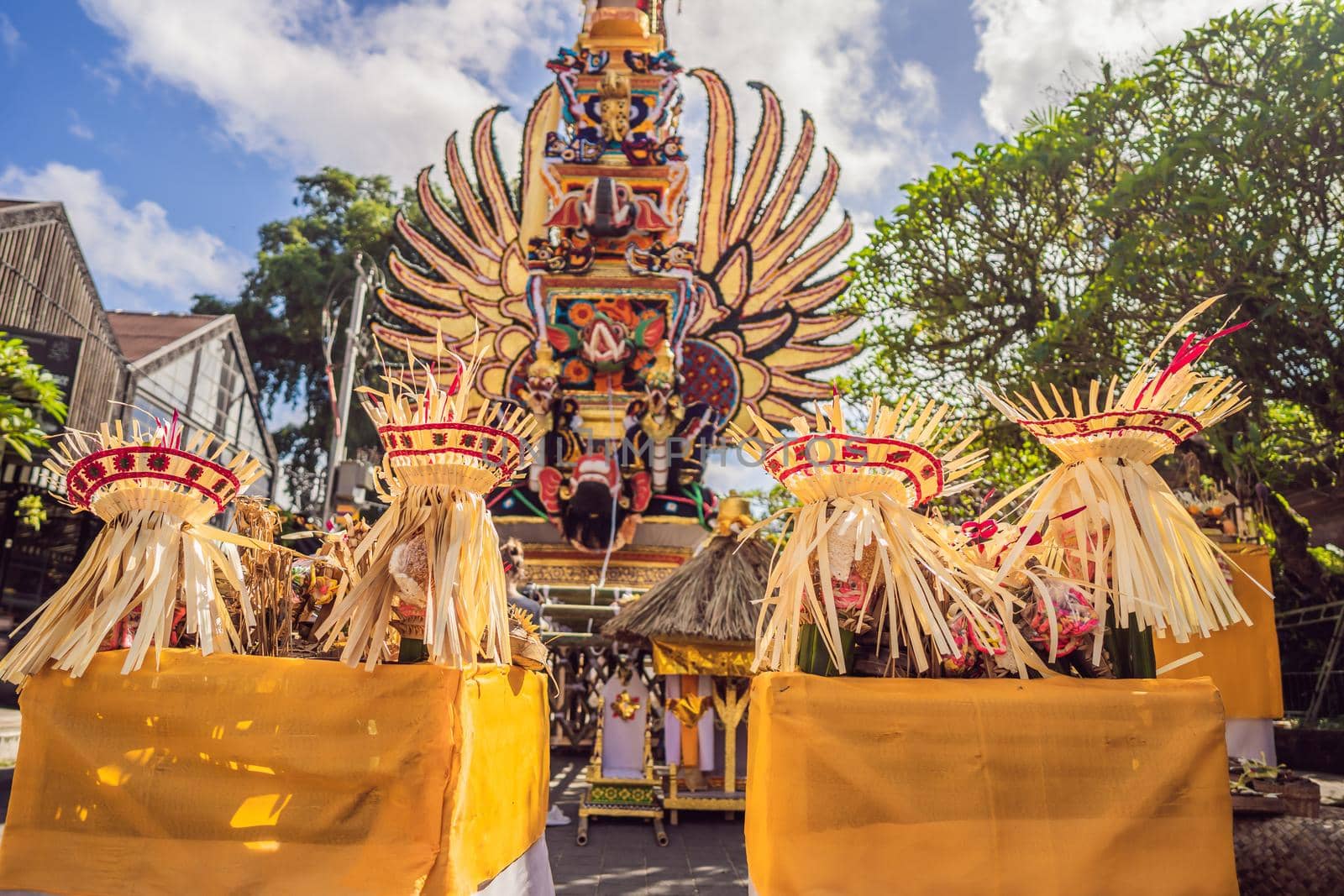 Bade cremation tower with traditional balinese sculptures of demons and flowers on central street in Ubud, Island Bali, Indonesia . Prepared for an upcoming cremation ceremony.