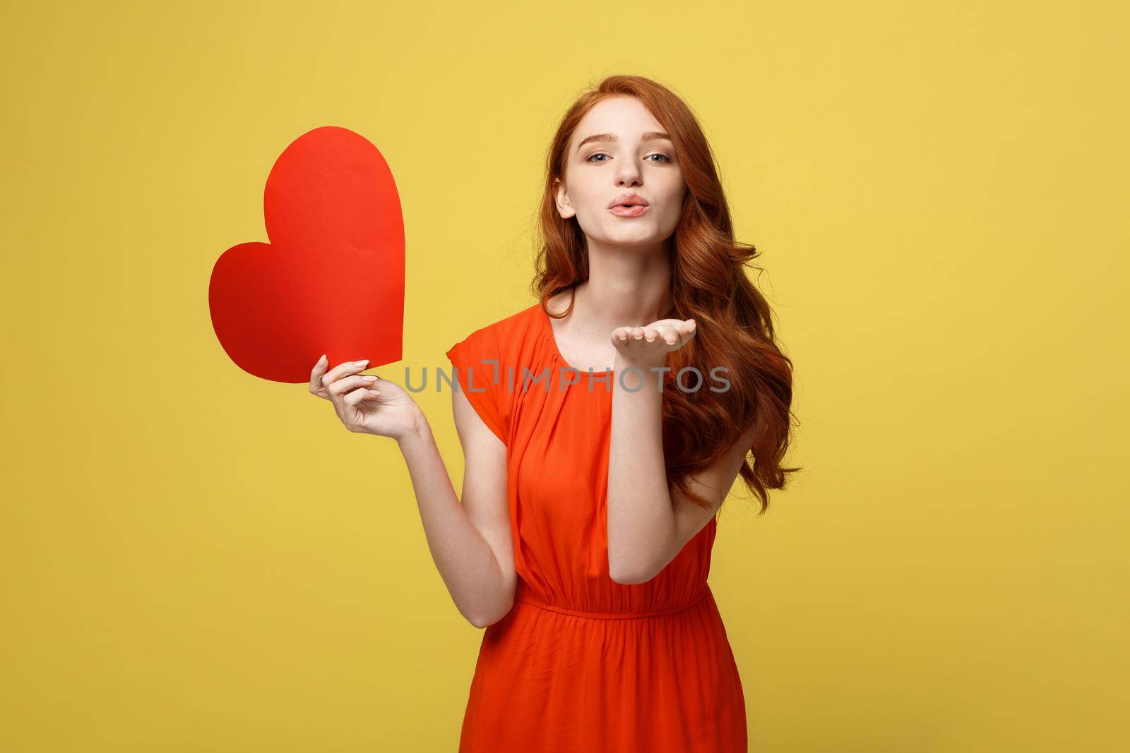 Portrait of happy romantic young caucasian girl with red paper heart-shaped postcard, romantic wishes, Valentine day celebration, love concept by Benzoix