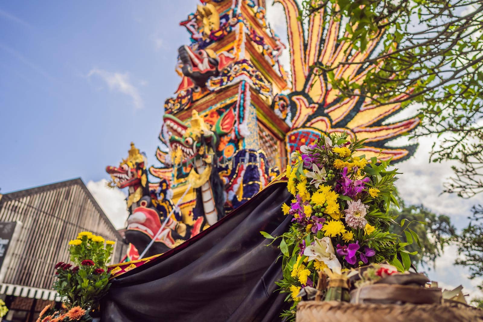 Bade cremation tower with traditional balinese sculptures of demons and flowers on central street in Ubud, Island Bali, Indonesia . Prepared for an upcoming cremation ceremony.