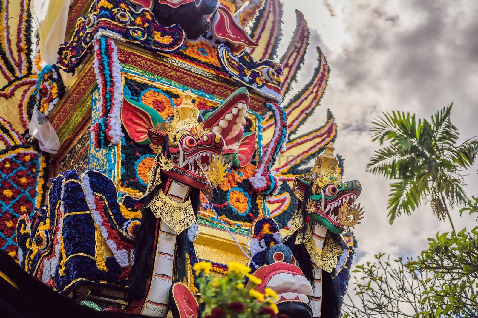 Bade cremation tower with traditional balinese sculptures of demons and flowers on central street in Ubud, Island Bali, Indonesia . Prepared for an upcoming cremation ceremony.