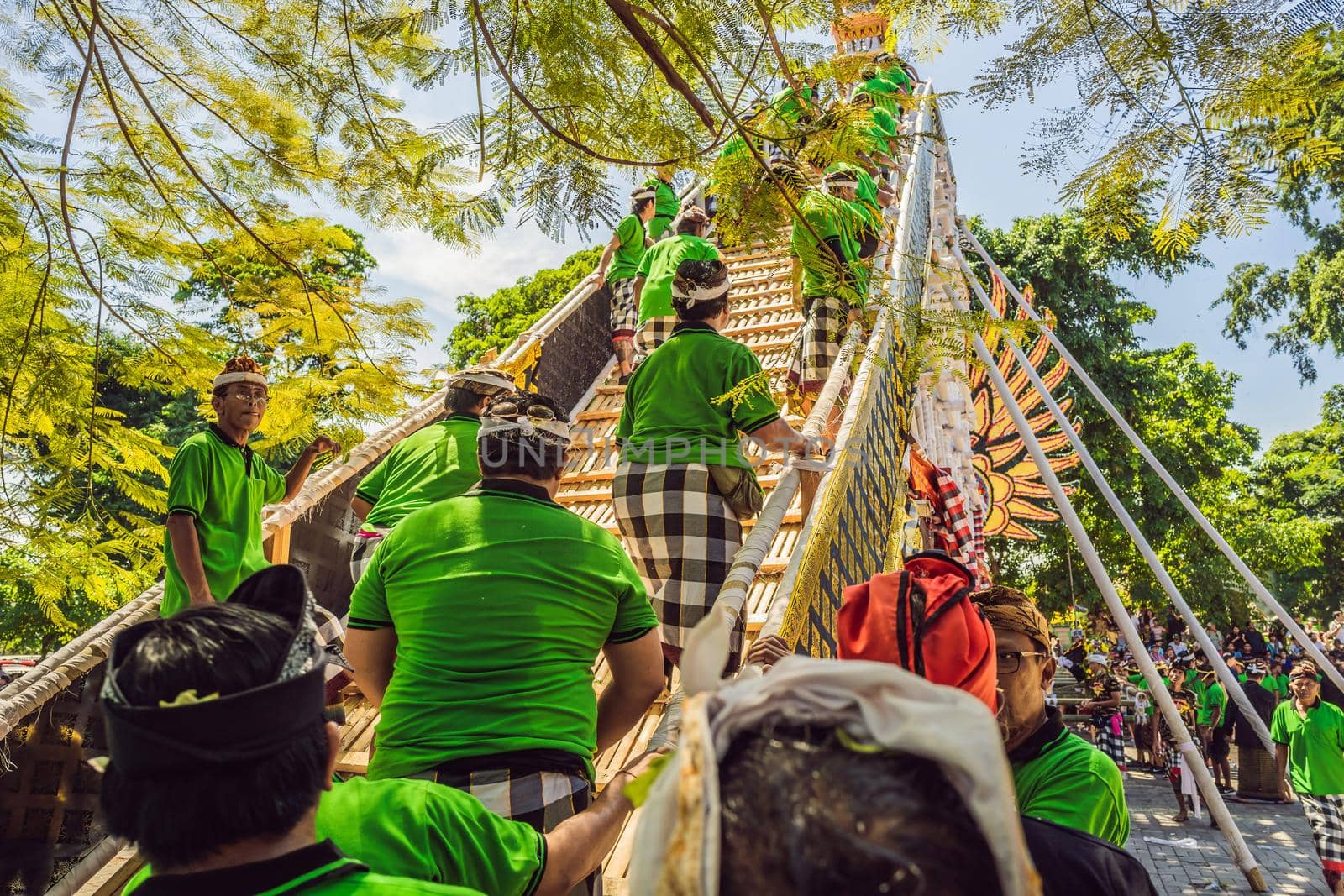 Ubud, Bali, Indonesia - April 22, 2019 : Royal cremation ceremony prepation. Balinese hindus religion procession. Bade and Lembu Black Bull symbol of transportation for the spirit to the heaven.