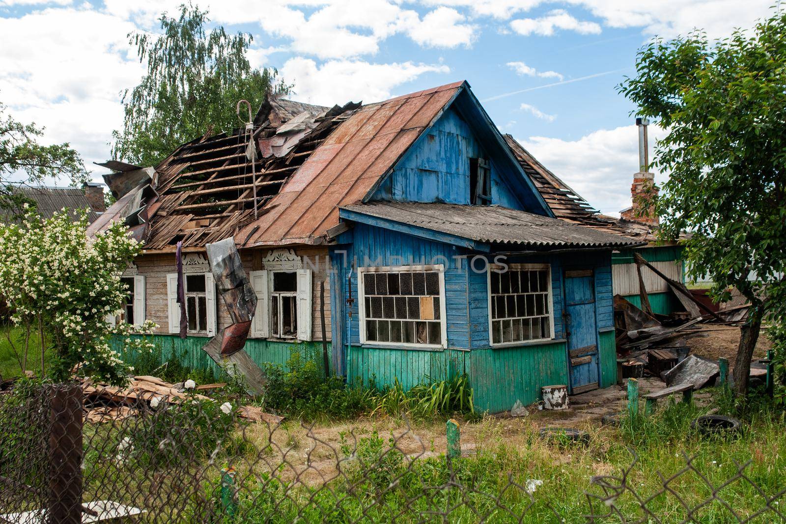 Old wooden house with a broken roof
