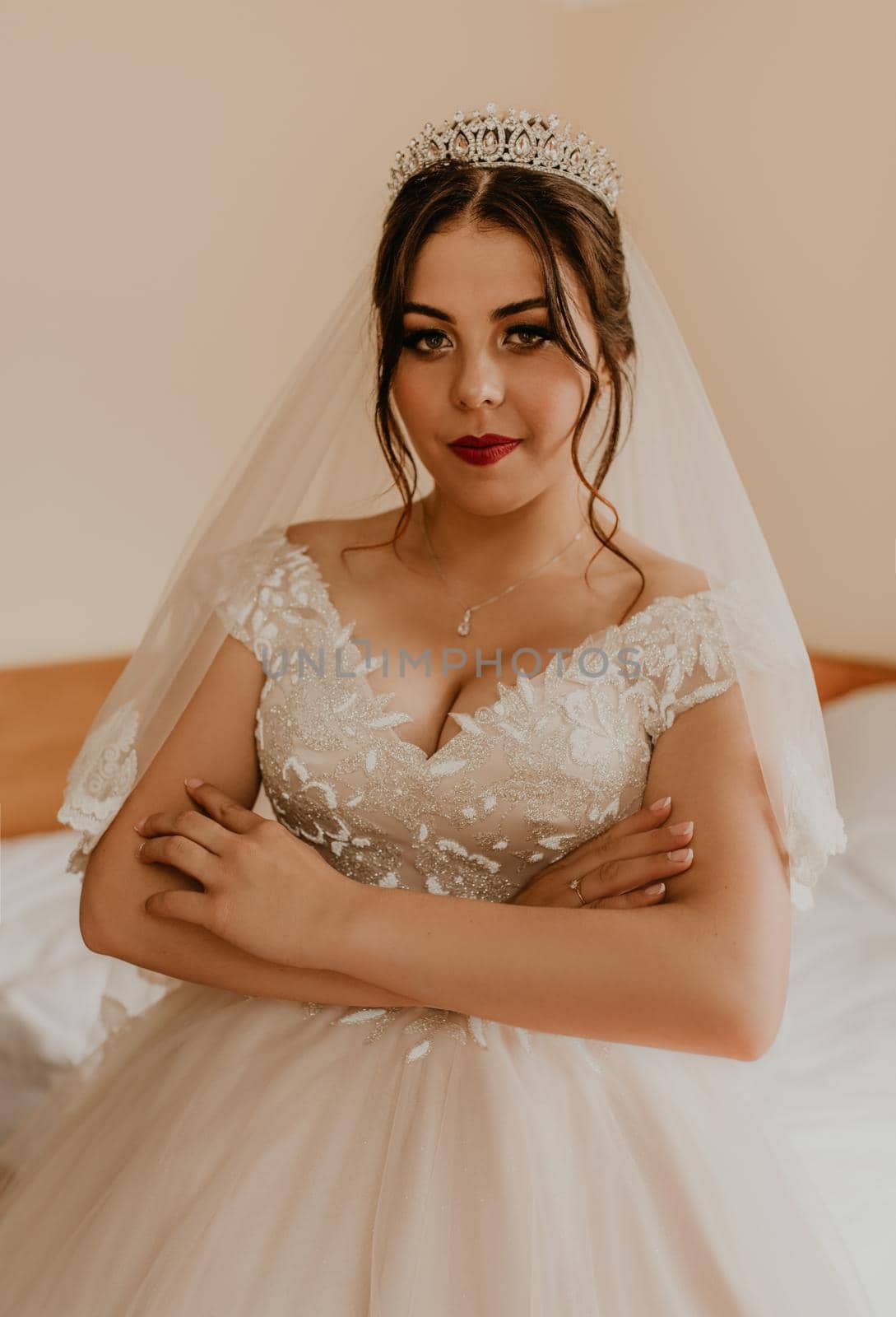 woman bride in white wedding dress with long veil and tiara on head by AndriiDrachuk