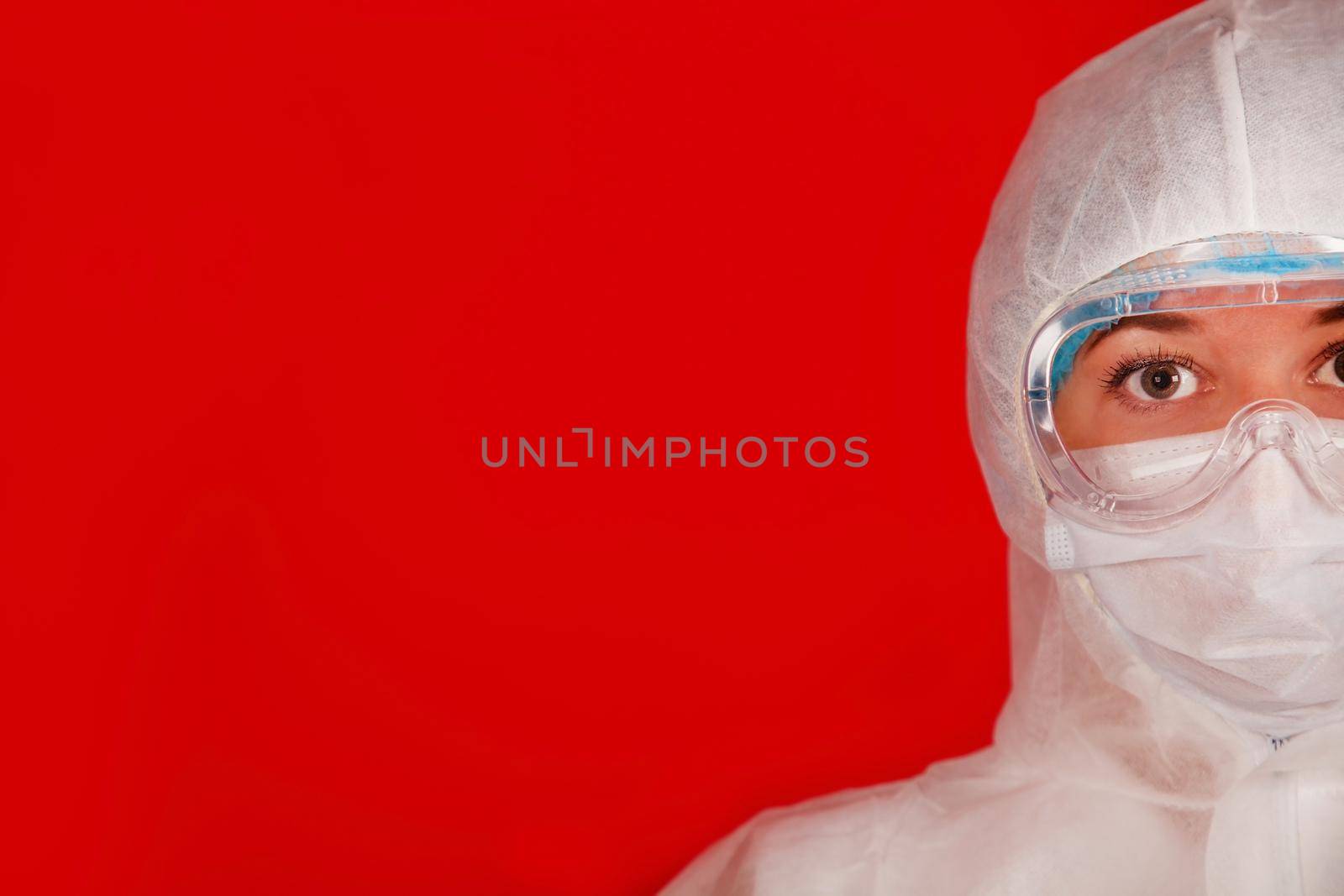 Doctor woman in a protective suit against coronavirus. Medical staff, preventive equipment. Doctor woman in a protective suit against coronavirus. Medical staff, preventive equipment