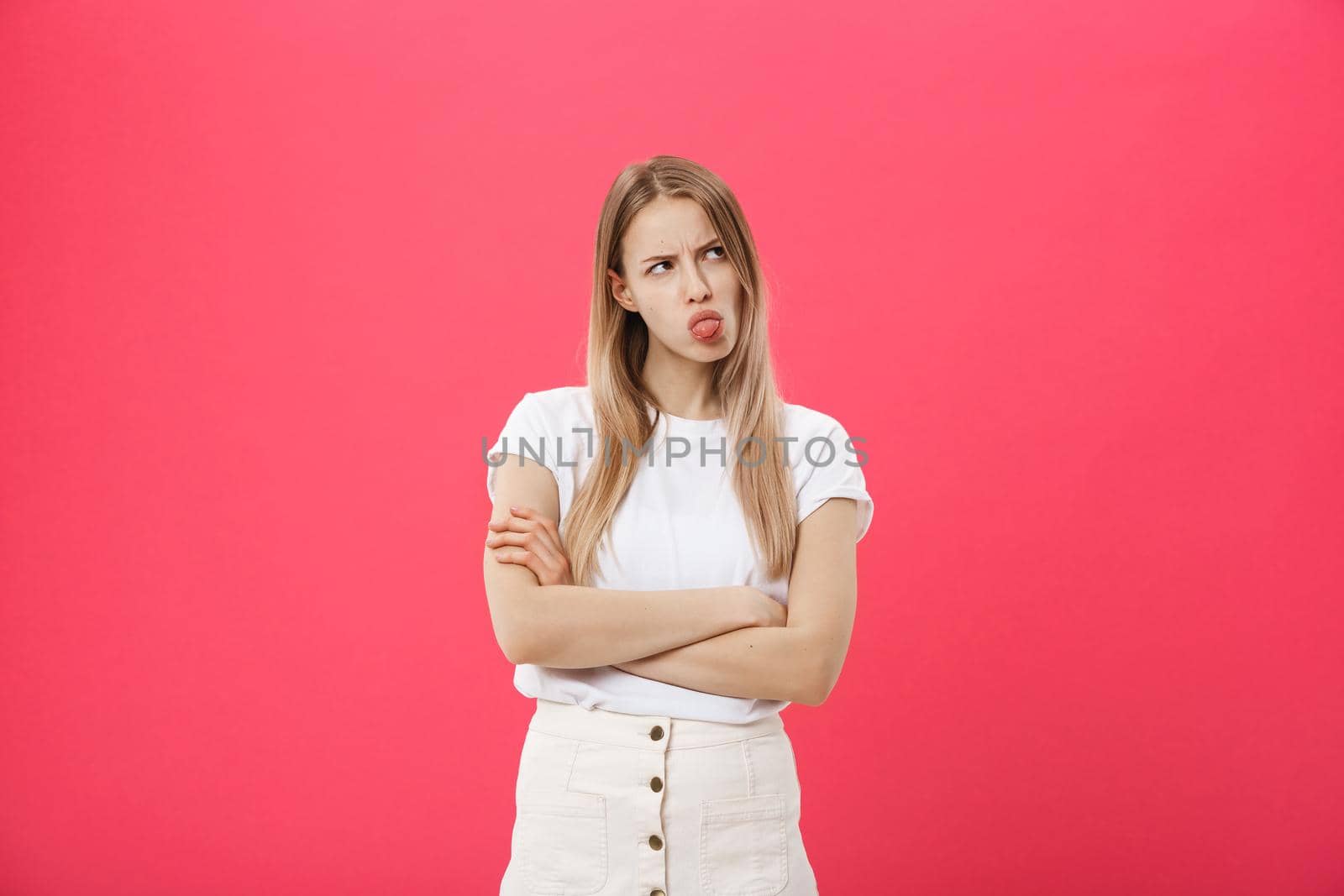 Bored woman. Boring, dull, tedious concept. Young pretty caucasian emotional woman. Human emotions, facial expression concept. Studio Isolated on trendy pink background by Benzoix