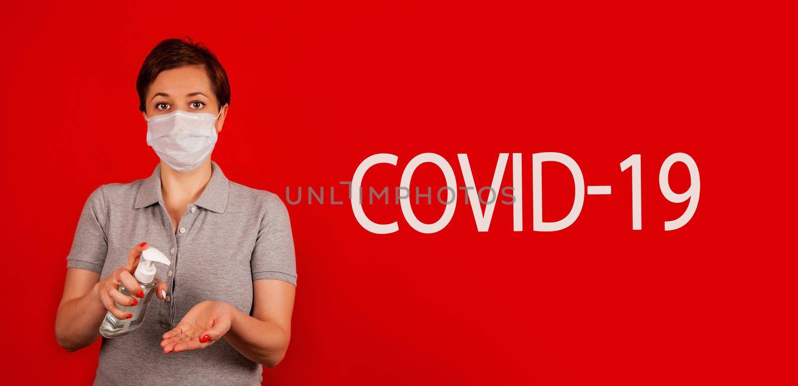 A woman uses a gel, disinfectant, antiseptic. Hand sanitizer prevents viral and plague infections, prevents the appearance of the Kovid-19 virus.