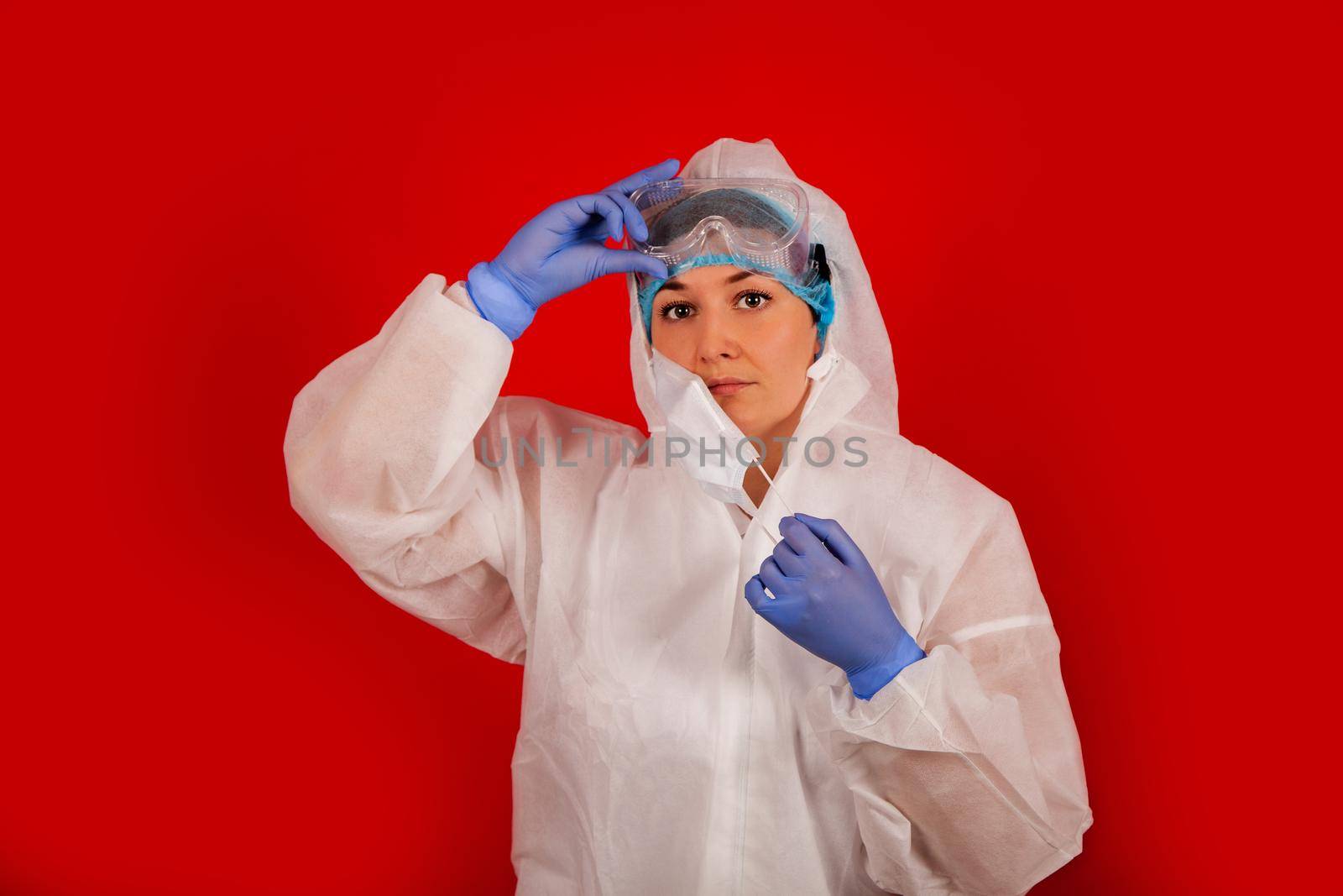 Doctor woman in a protective suit against coronavirus. Medical staff, preventive equipment. Doctor woman in a protective suit against coronavirus. Medical staff, preventive equipment