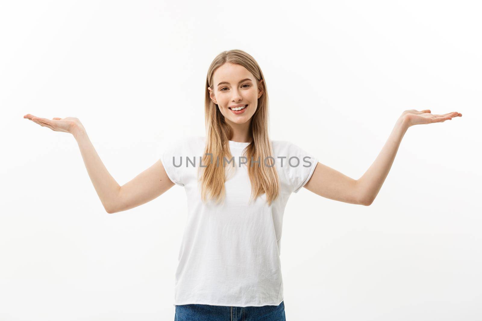 Portrait of young caucasian woman smiling and presenting two hands on side. Isolated on white background by Benzoix