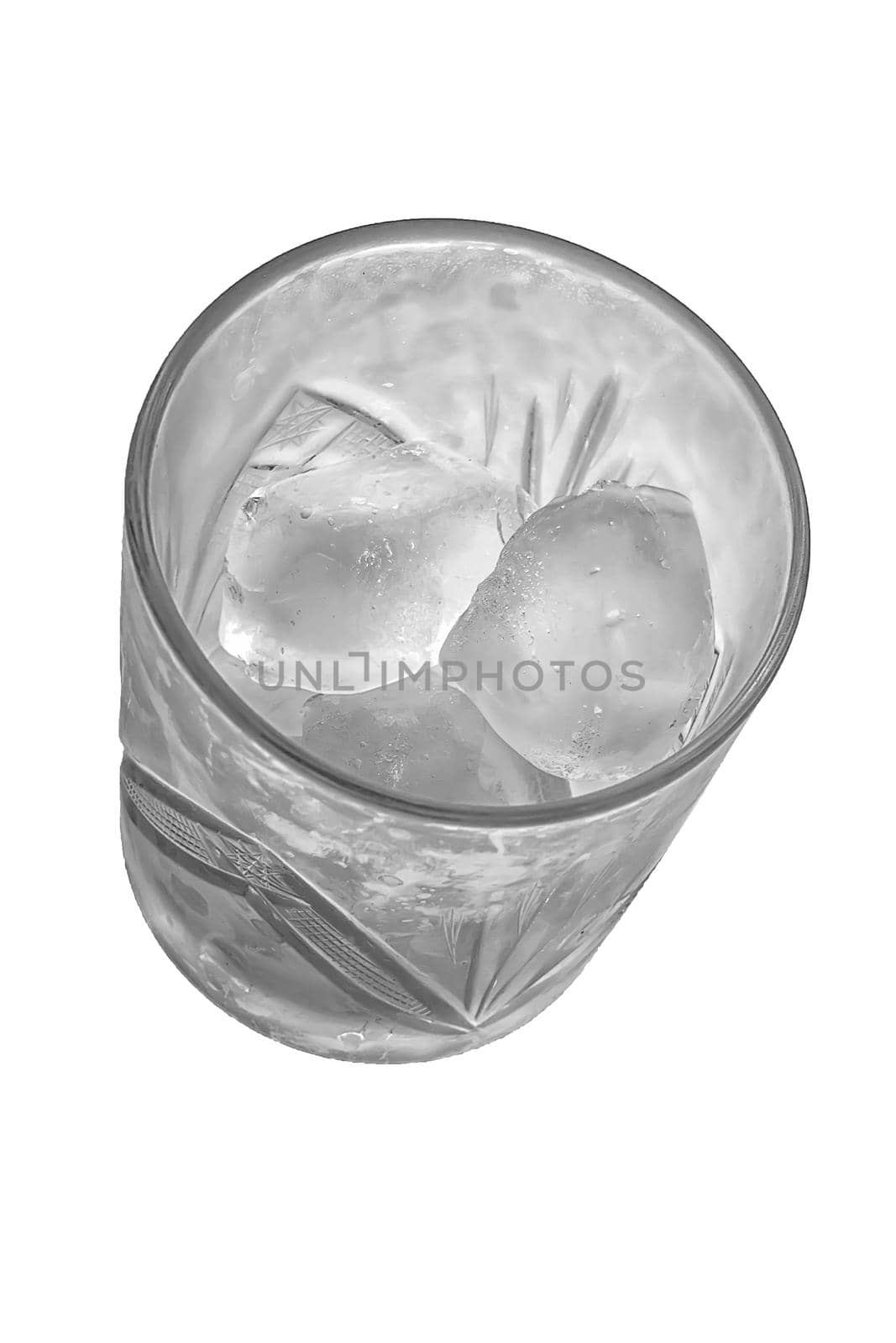 Black and white view of glass with ice cubes. Top view. Isolates